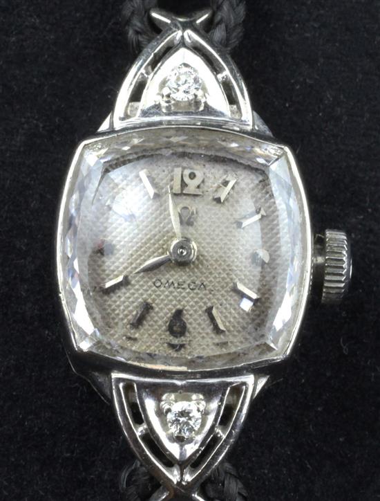 A ladys 1950s 14ct gold and diamond set Omega manual wind cocktail watch,